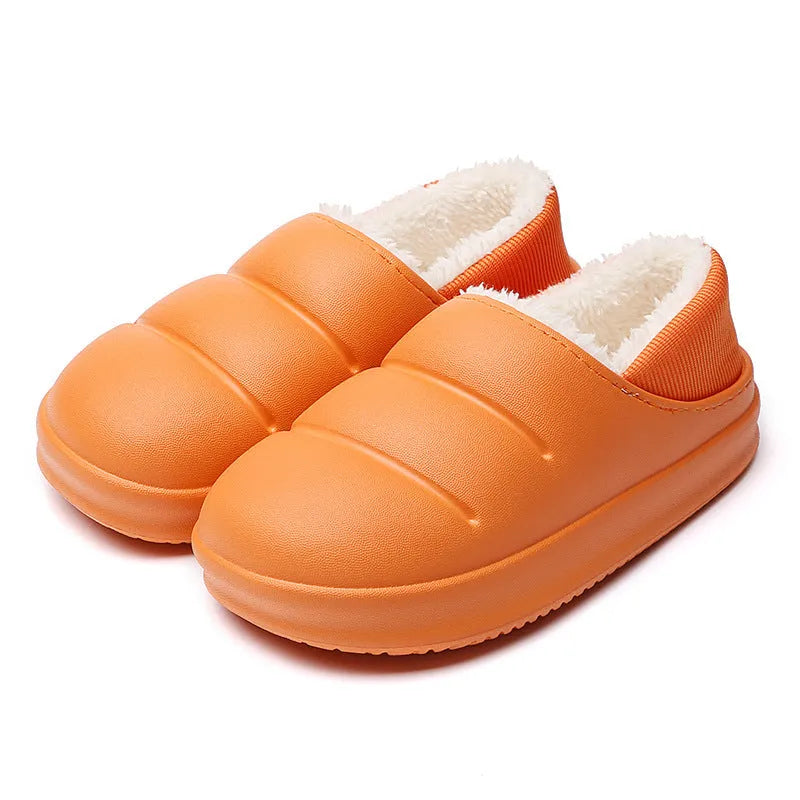 A pair of waterproof EVA couple slippers with a warm plush lining, shown in a green colour option.