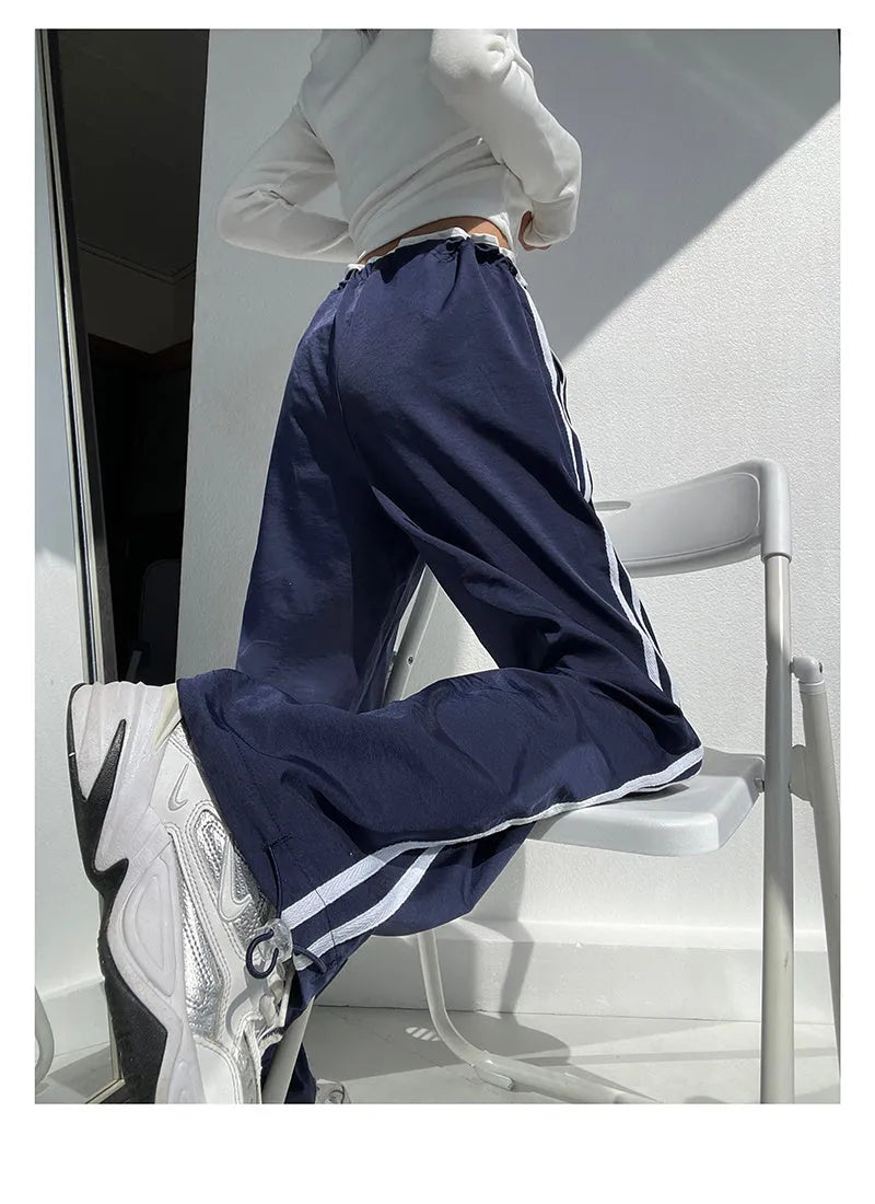 Low-waist loose straight-leg trousers with ribbon parallel bars detail in navy blue