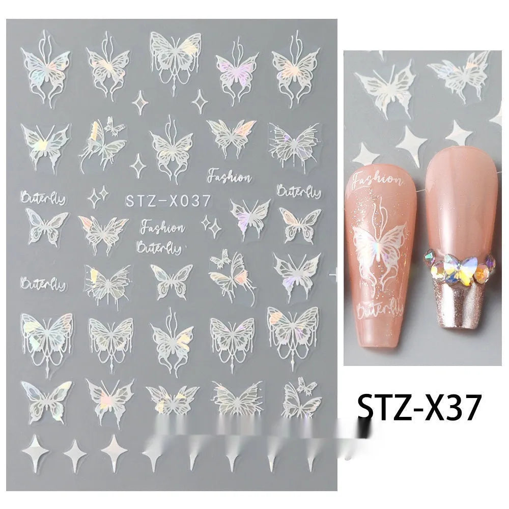 Cartoon love pattern nail art sticker decals in black and silver colours on a plastic sheet.