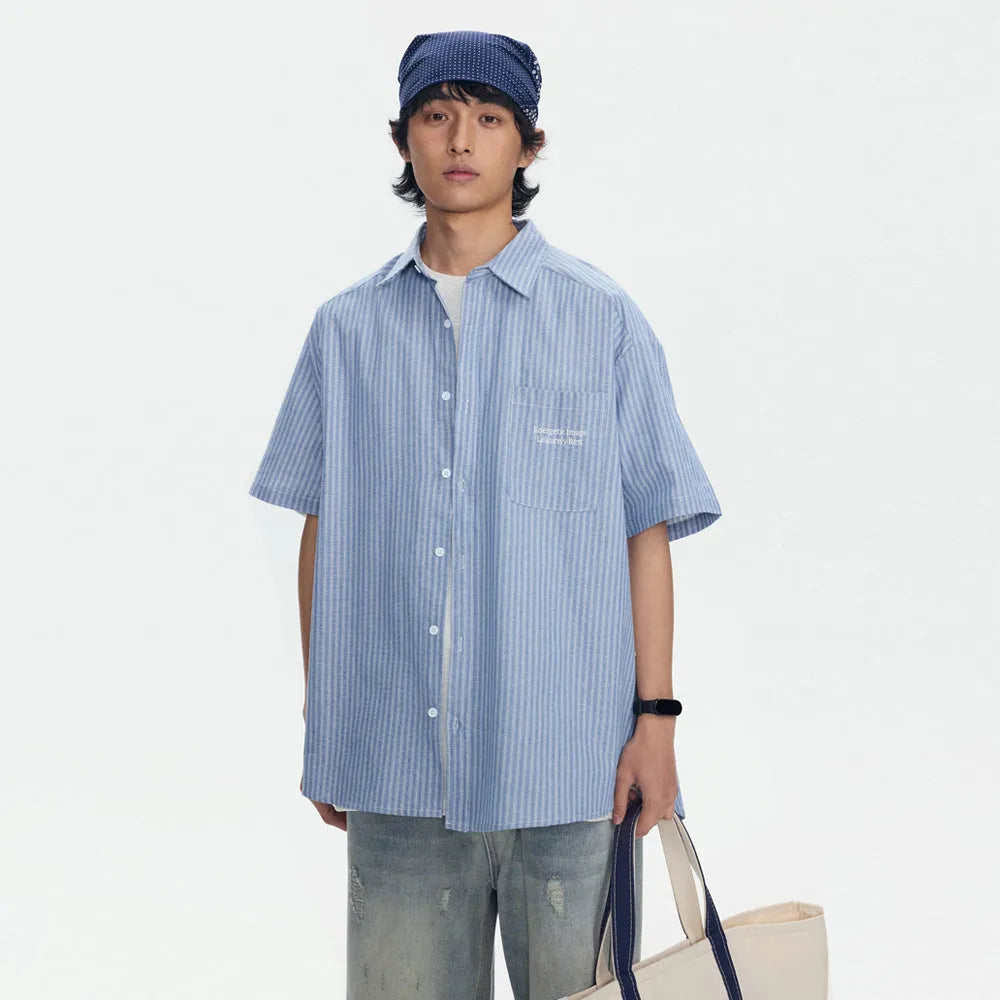 Blue striped short-sleeved shirt cardigan with a loose fit on a hanger.