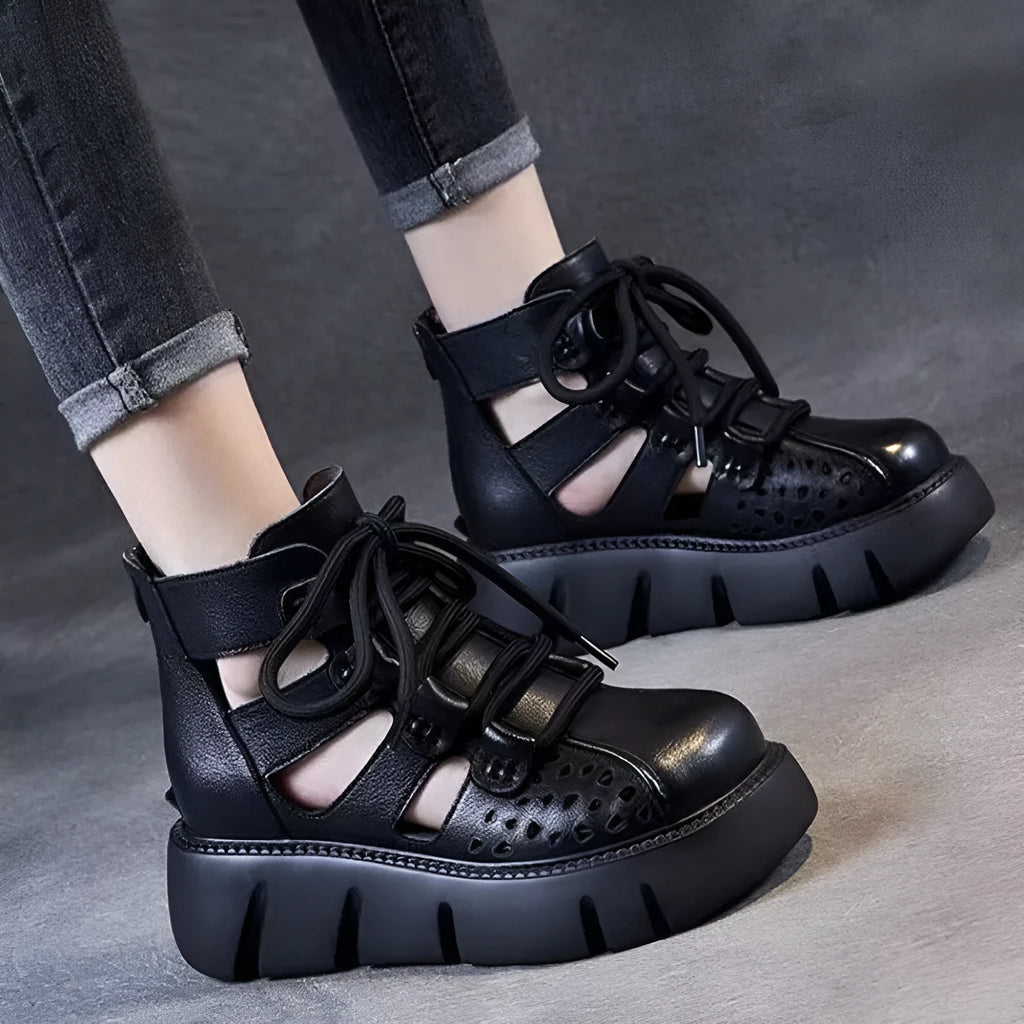 Women's black platform sandals with hollow hole design and fish mouth toe in soft cowhide leather.