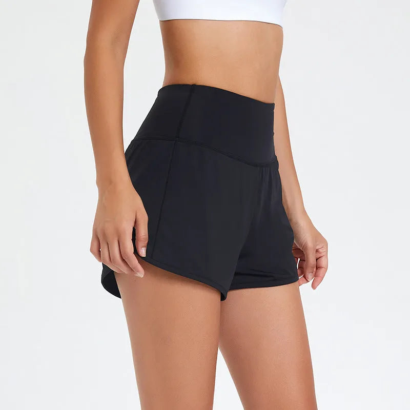 Nylon women's high-waist fitness shorts in black, shown on model for running or gym use.