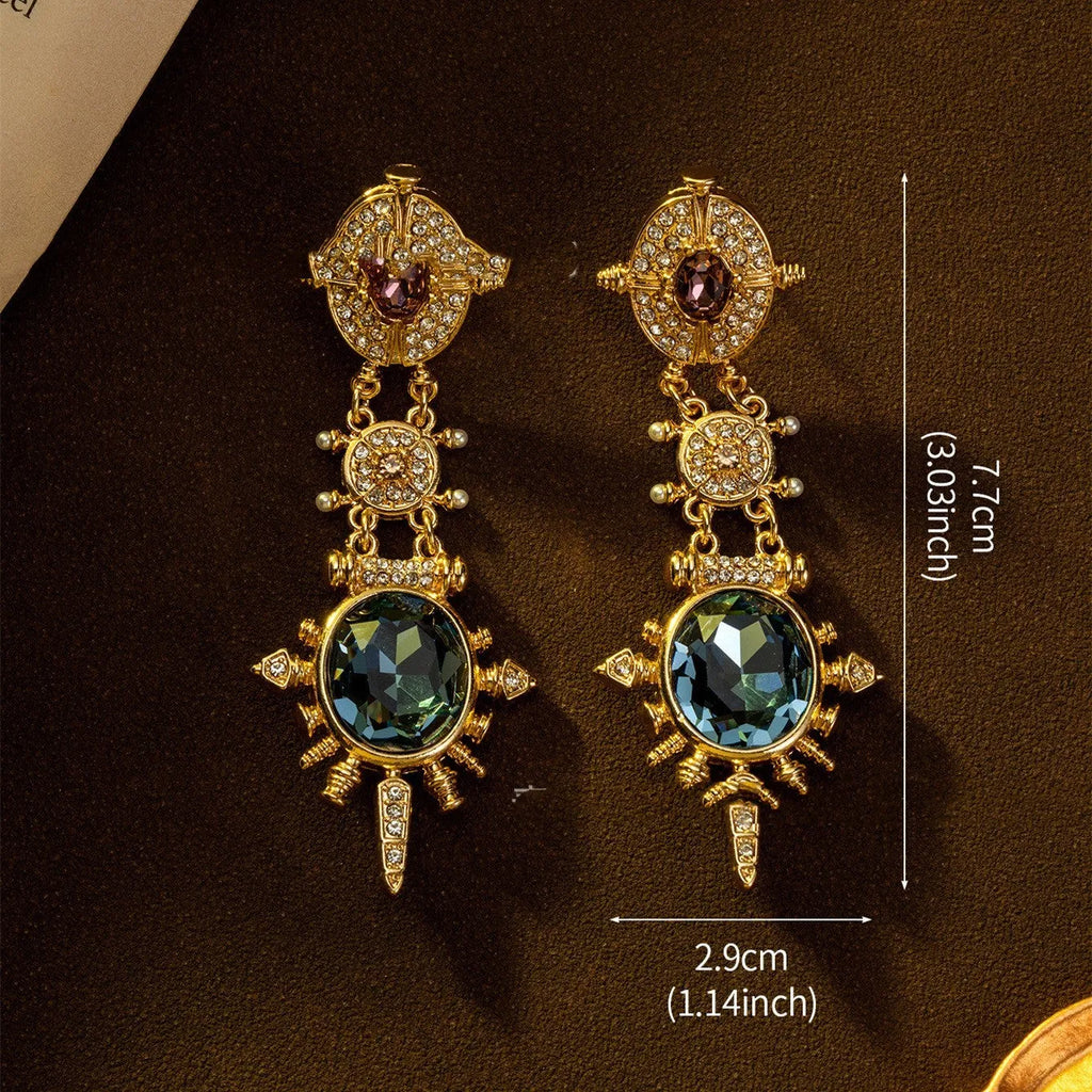 A pair of gold-coloured geometric round stud earrings with a retro style and diamond-treated alloy finish.