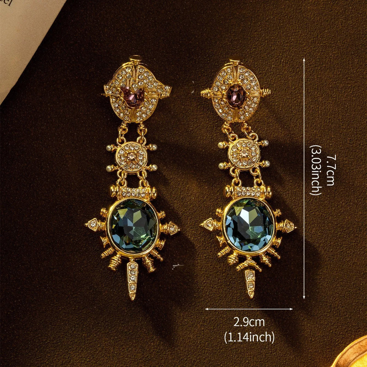 A pair of gold-coloured geometric round stud earrings with a retro style and diamond-treated alloy finish.