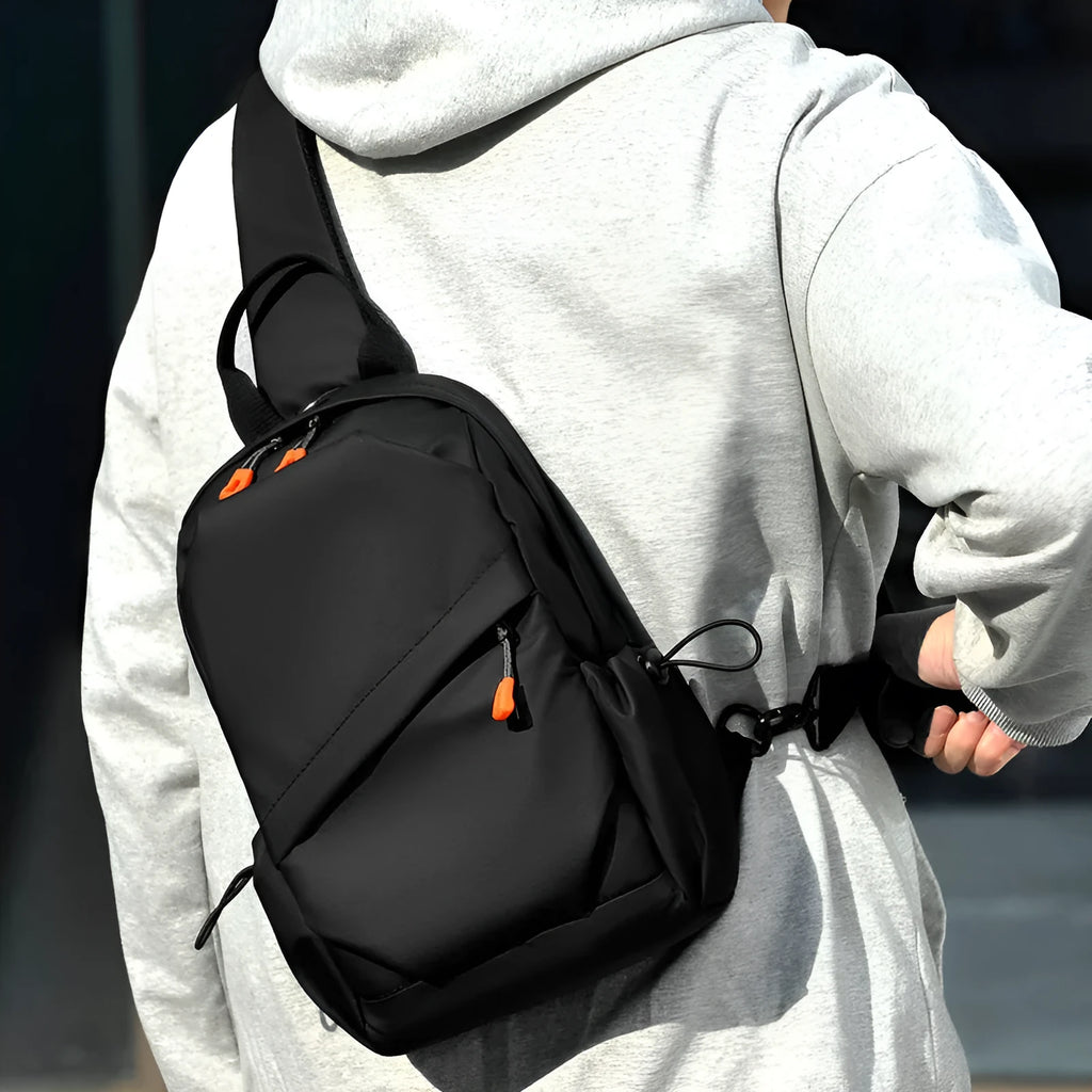 Men's black casual crossbody bag with a single shoulder strap made from waterproof polyester.