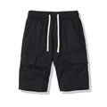 Men's loose cropped polyester pants with multiple pockets in dark grey colour