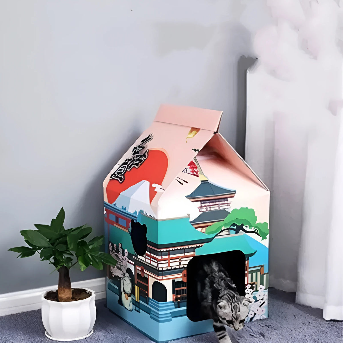 Foldable corrugated paper cat scratching board in Nagoya design colour, shown both flat and folded.