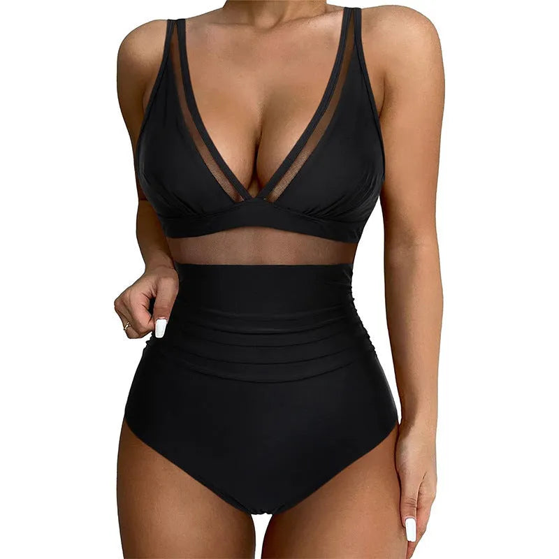 Black women's halter neck one-piece swimsuit with mesh panels and briefs style bottom.