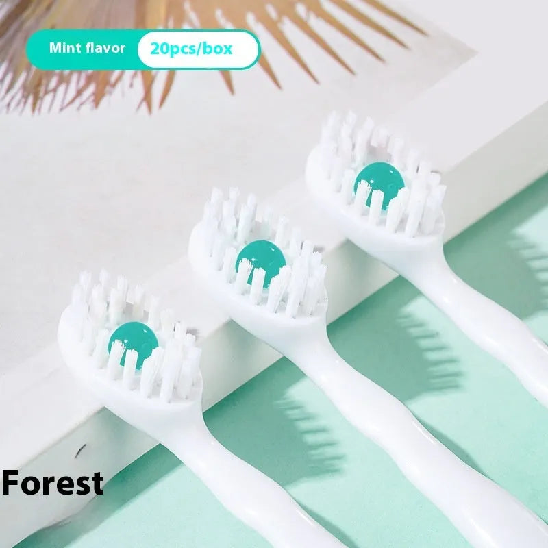 Box of disposable bead toothbrushes with integrated toothpaste beads for travel and portable oral care.