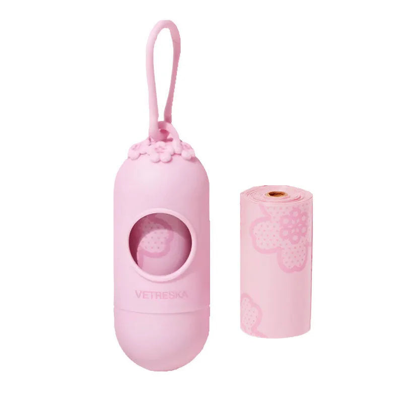 Dog waste disposal capsule with biodegradable bags in strawberry, orange, and cherry blossom colour options