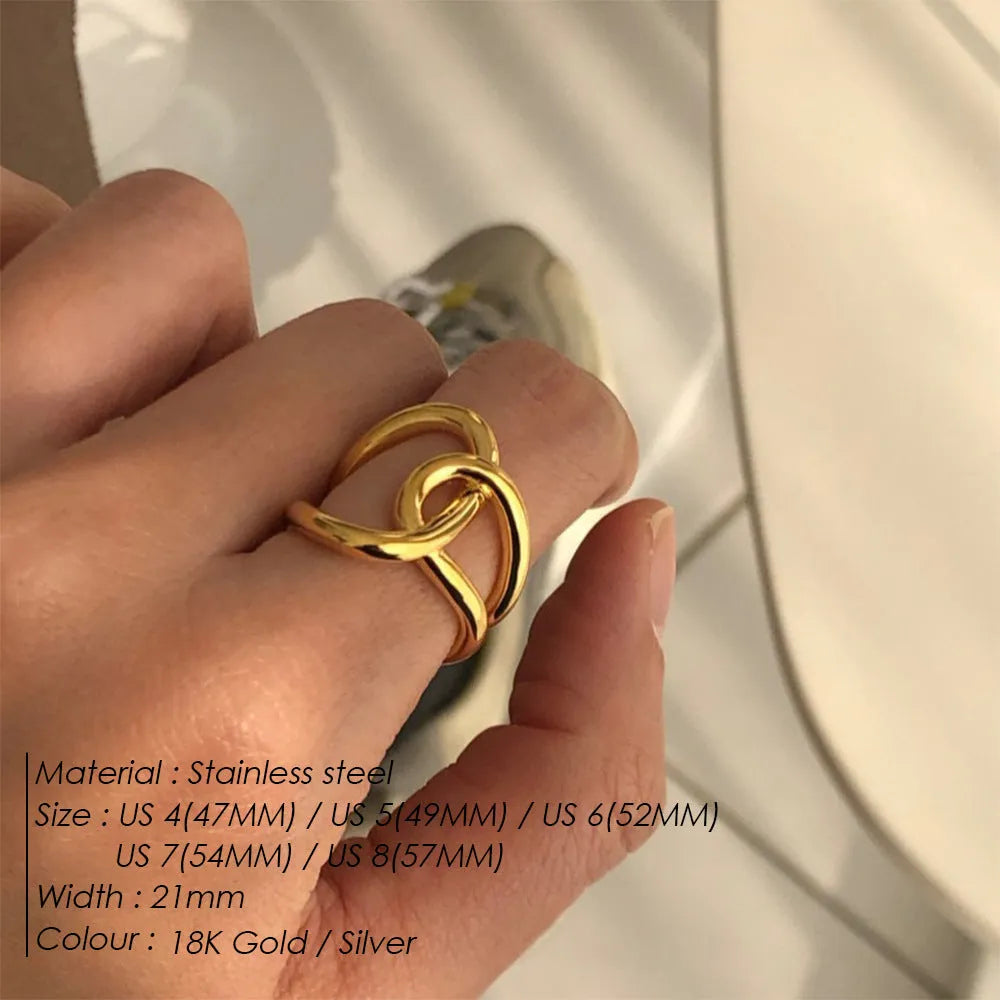Adjustable stainless steel women's ring with geometric knot design on a U-shaped open band.