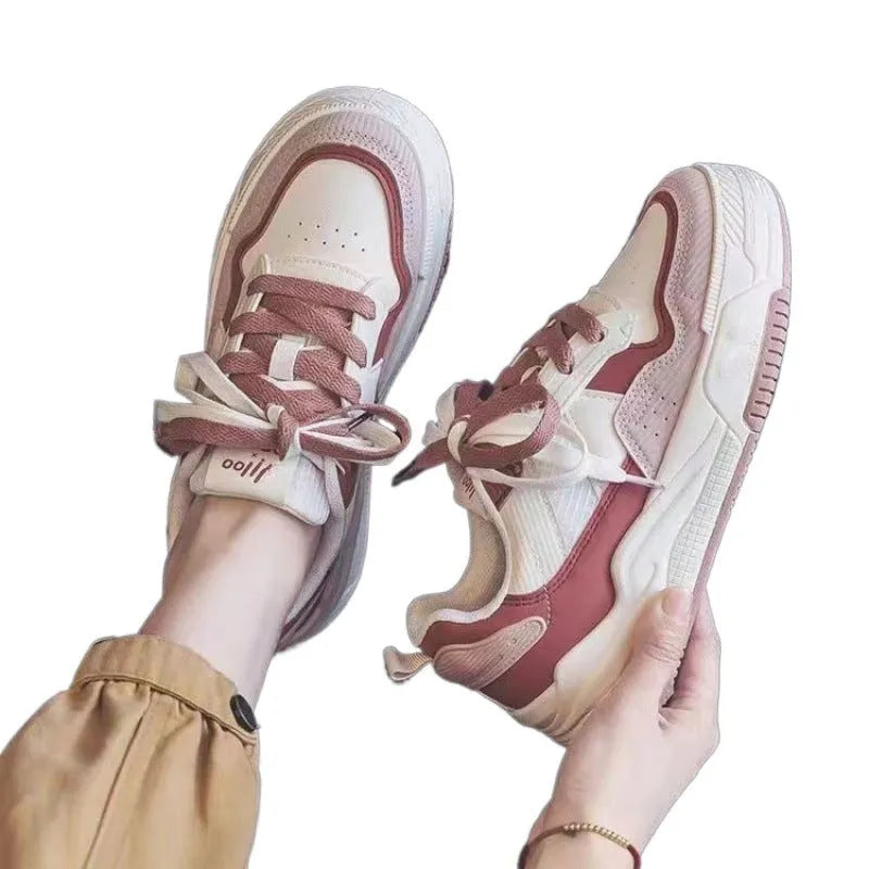 Low top rubber sneaker in pink or milky white with height increasing sole and breathable design