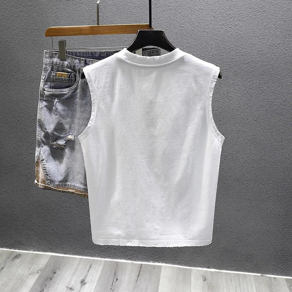 Loose fit cotton sleeveless t-shirt in black on a hanger, showing straight hem design.