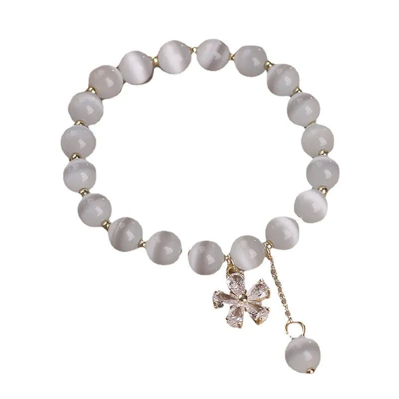 Women's white cat's eye crystal bracelet with flower tassels and morganite safety buckle pendant
