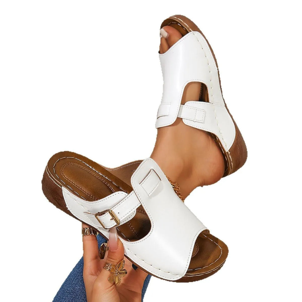 Women's white Roman style summer slippers with fish mouth toe and EVA sole.
