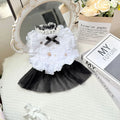 White polyester princess style gauze skirt for a small dog on a hanger, showing the layered skirt design.