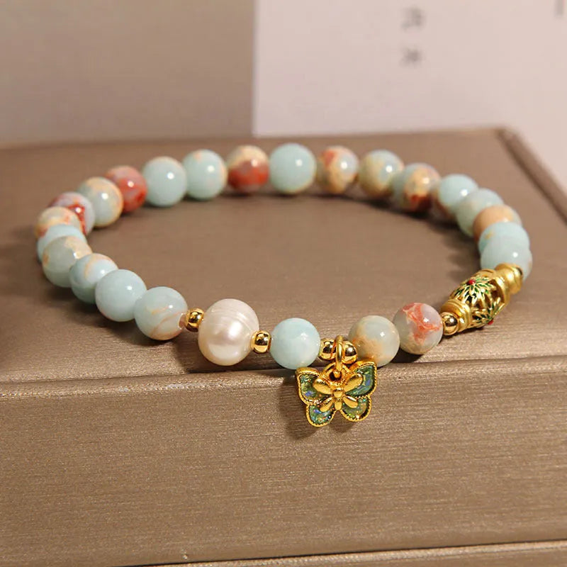 Blue women's bracelet with butterfly pendant, freshwater pearl, and Shoushan Stone elements