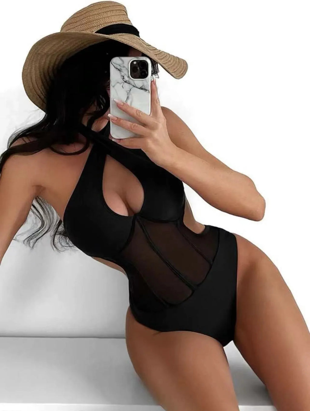 Women's black one-piece racerback swimsuit made from nylon and spandex blend fabric.