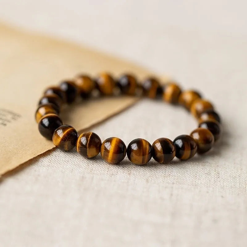 Tigereye bead Buddha rosary bracelet in a single circle ethnic style, showing simple and dzi bead colour options.