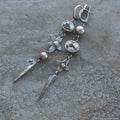 Long geometric XINGX design pendant earrings in antique silver tone with rhinestones.