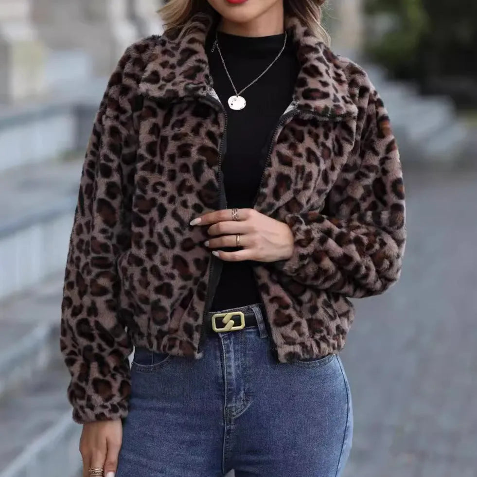 Women's loose-fitting leopard print coat with full zipper and raglan sleeves on a hanger