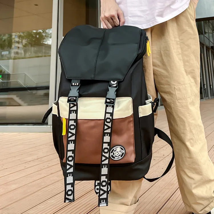 Oxford cloth school backpack in black, green, or red with handheld, shoulder and backpack carrying options