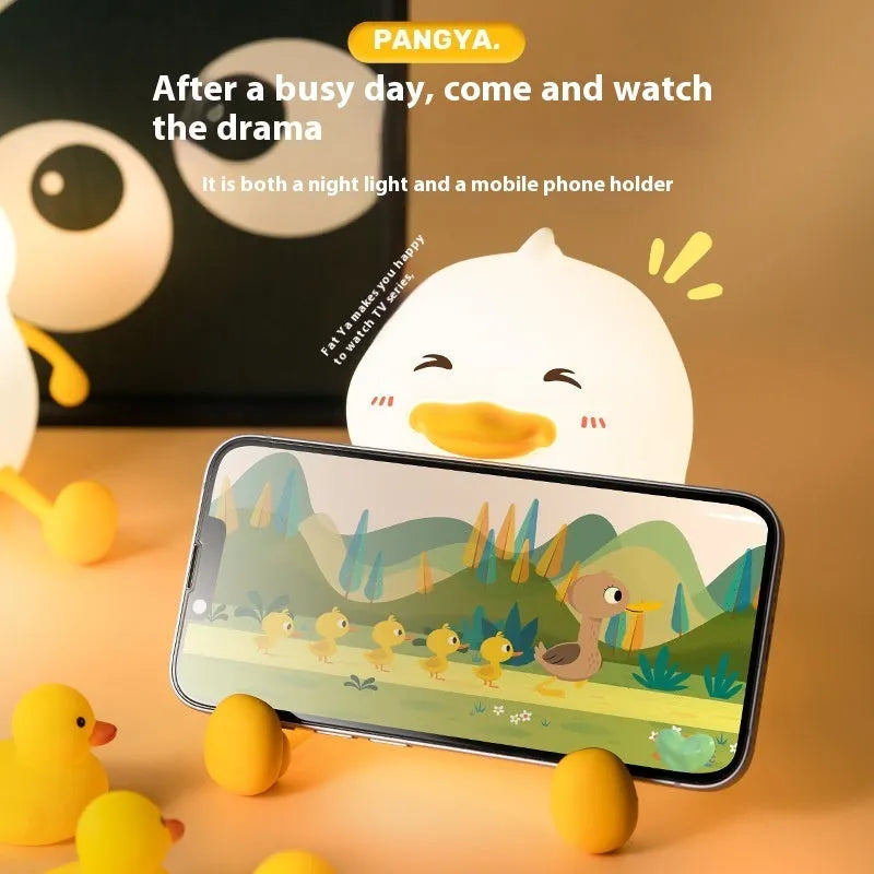 Chubby silicone pet night light desk lamp with integrated phone holder showing dimensions 108x104x128mm