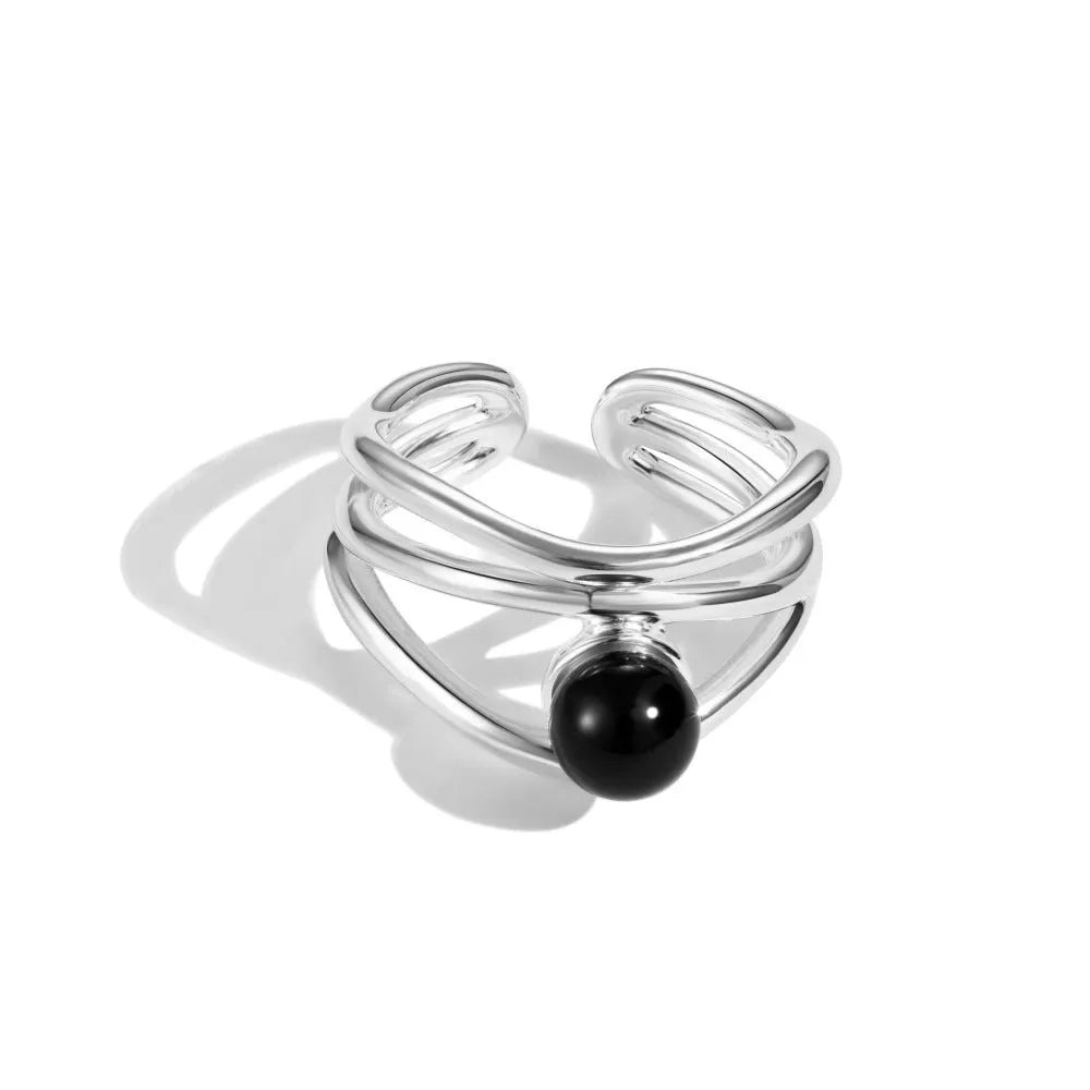 S925 sterling silver women's ring with inlaid black agate, multi-line hollow geometric design, adjustable open band.