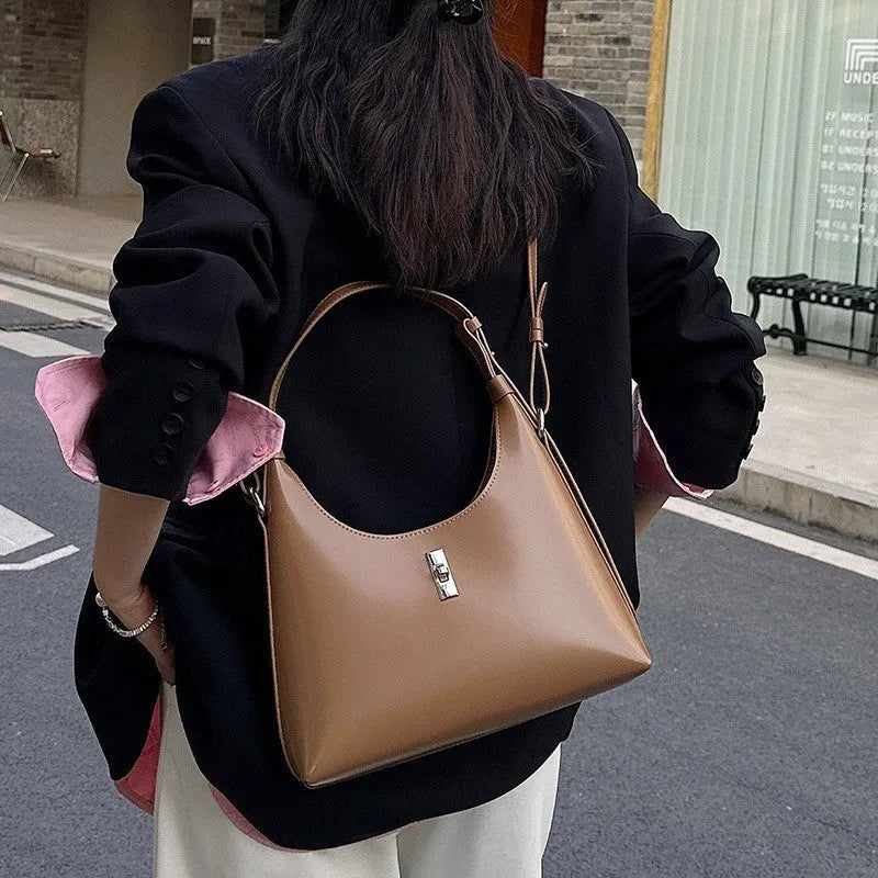 Genuine leather crossbody shoulder bag with dumpling shape and sandwich pocket design