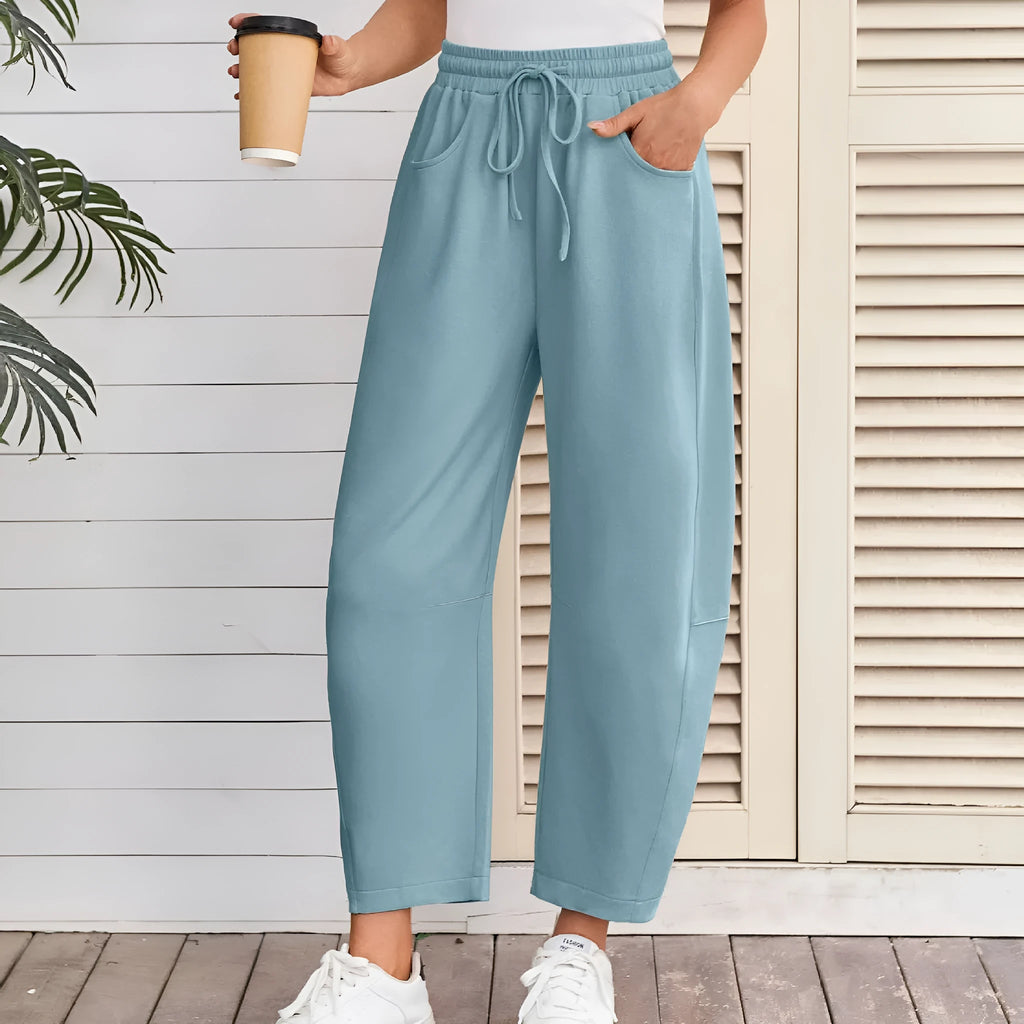 Loose cropped sweatpants with drawstring elastic waist in street fashion styling