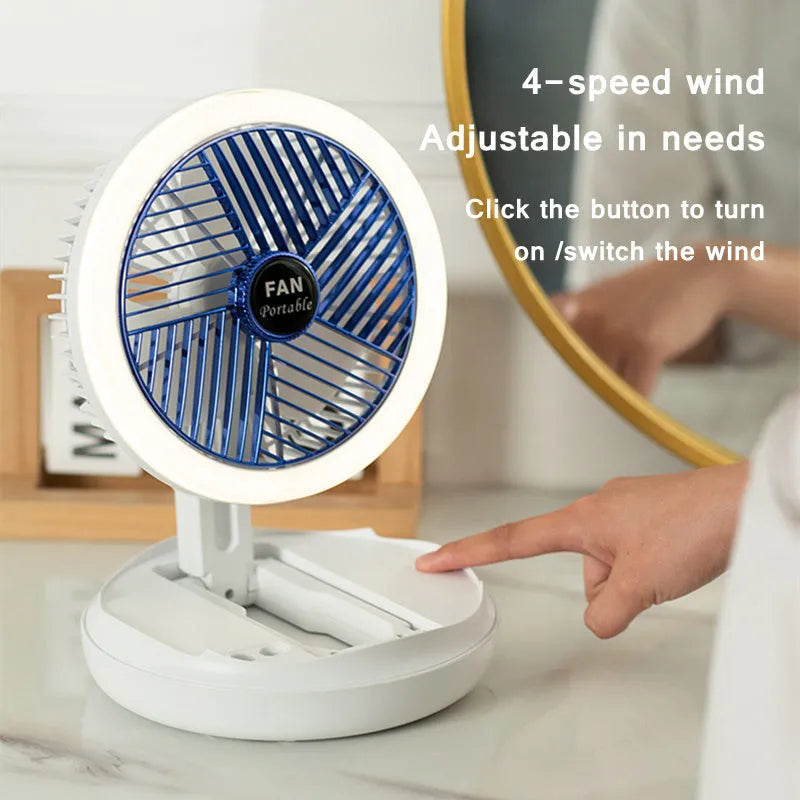 Blue foldable USB desk fan with LED light showing adjustable head and pen holder