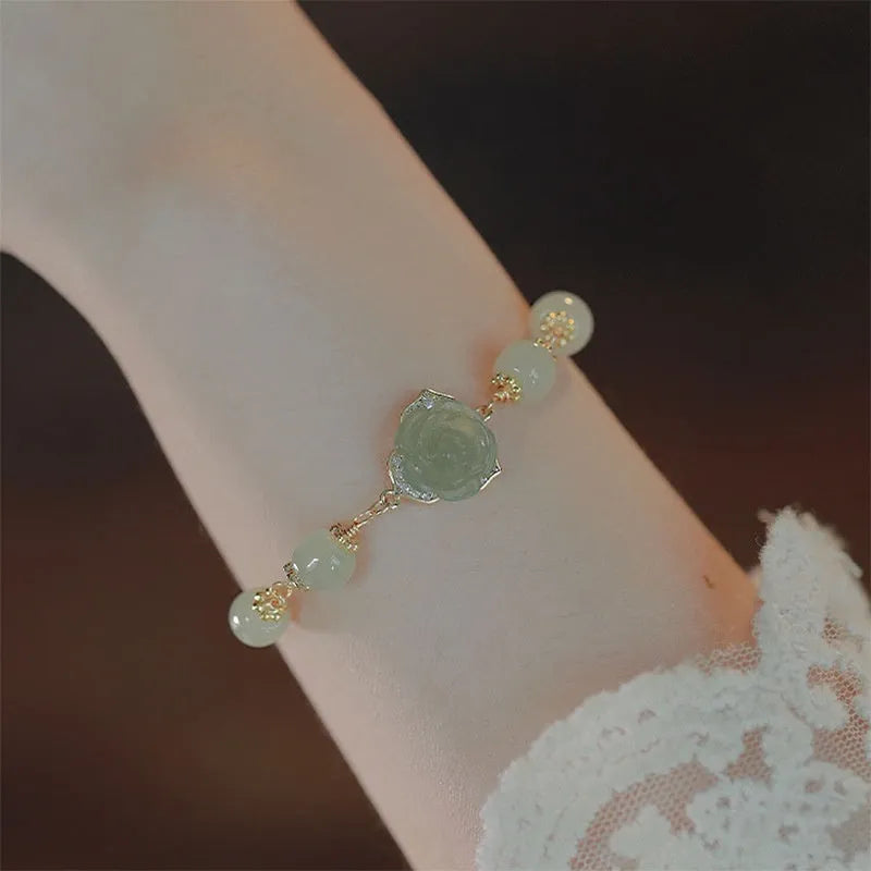 Women's bracelet with Hetian jade rose petals and 14K gold gilding in a floral design.