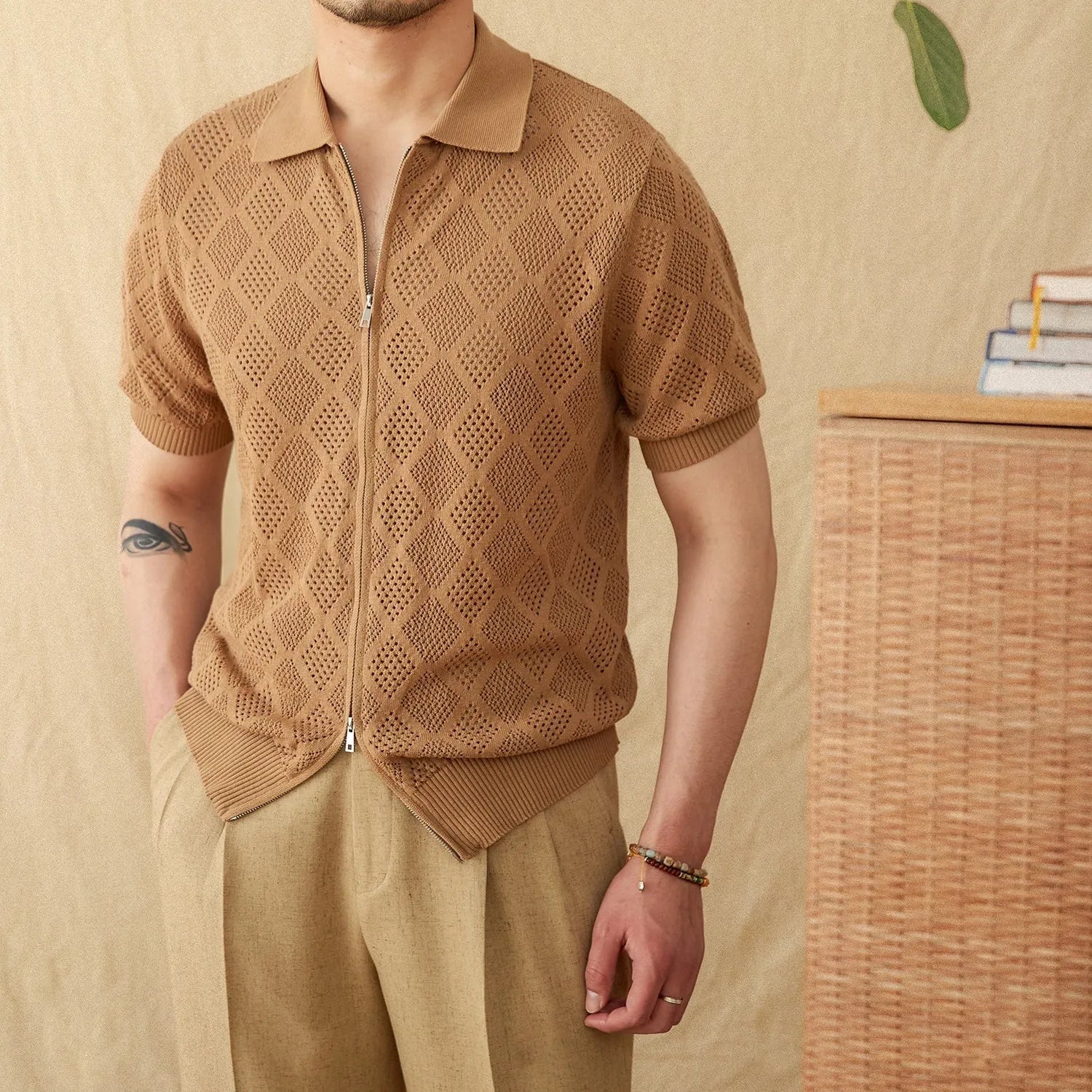Light brown zip-front cotton cardigan with a lapel collar and short sleeves.