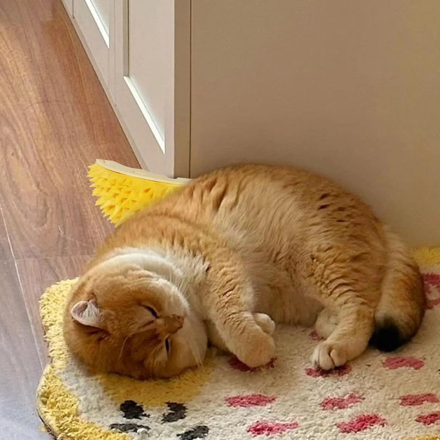 Yellow durian-shaped cat corner scratcher and grooming comb toy with peppermint powder.