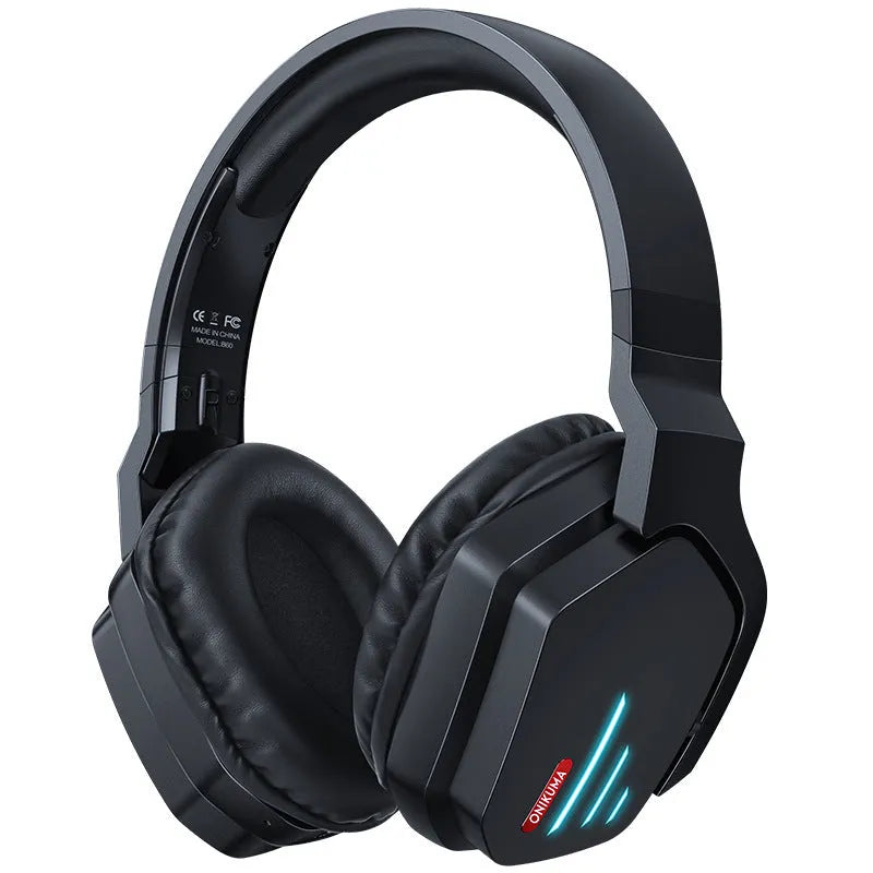 Luminous black wireless over-ear gaming headphones shown with a 3.5mm audio cable and dust bag.
