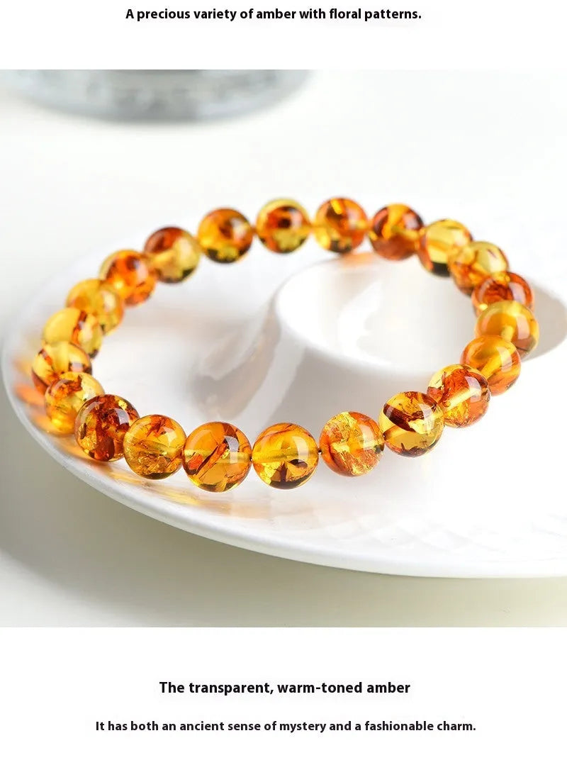 Natural yellow piebald amber bracelet with geometric beads in polished finish