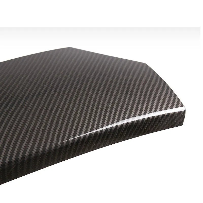 Three black ABS armrest box protective covers with a shiny carbon fibre weave pattern.