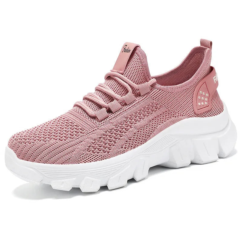 Women's white sneaker with thick PVC sole and breathable flyknit upper