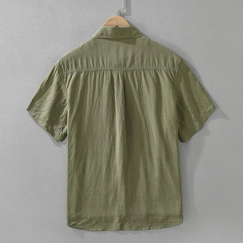 Women's loose lyocell cardigan-style top in black, green, and purple colours on a hanger.