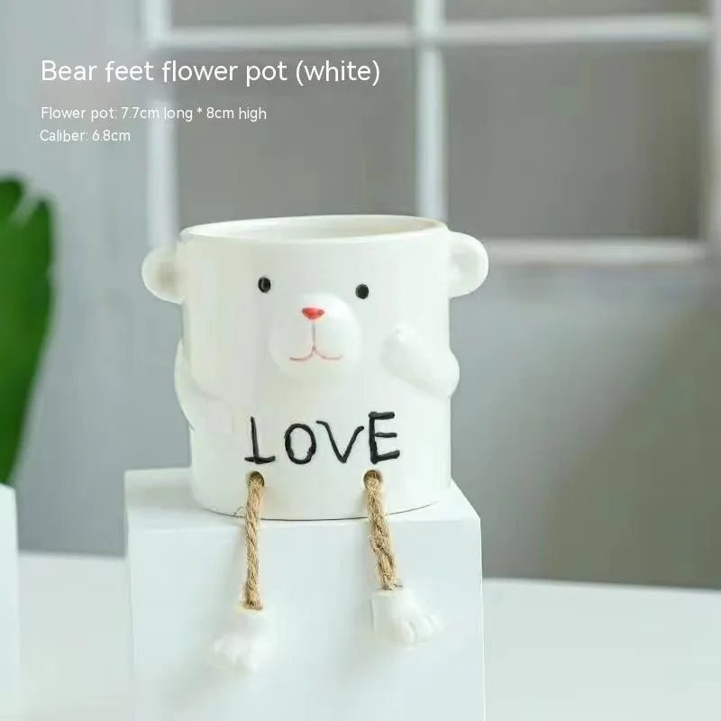 Ceramic hanging foot flowerpot for succulent plants in cartoon style with twelve colour variations on desktop