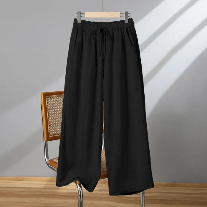 Women's straight-leg casual trousers with elastic waist and drawstring detail in polyester fabric