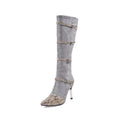 Grey and black women's knee high boots with thin 9cm high heels on a rubber sole.