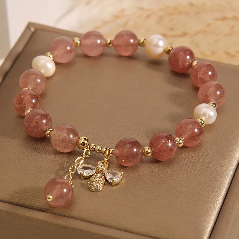 Women's bracelet with freshwater pearls and strawberry quartz stones with zircon accents on alloy hardware