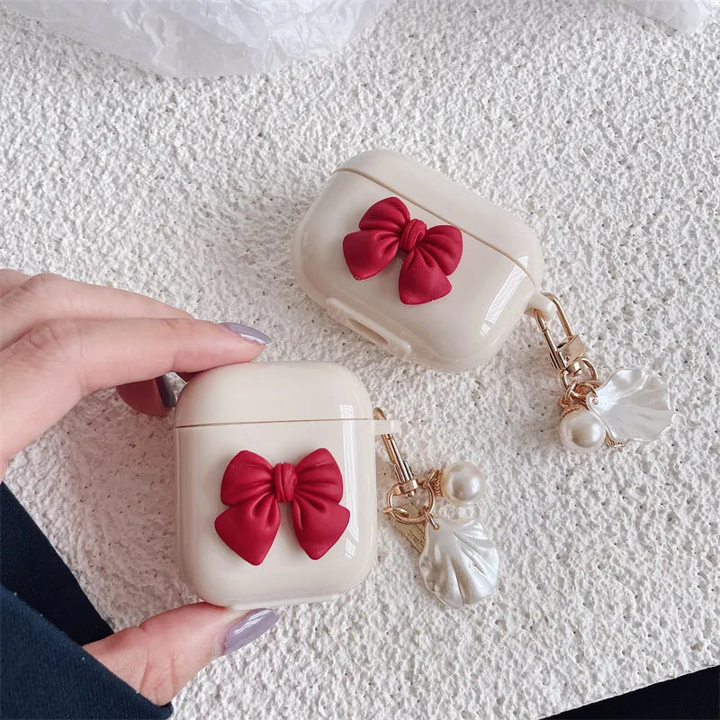 Beige red bow shell TPU protective case with clamshell closure for AirPods Pro wireless earphones