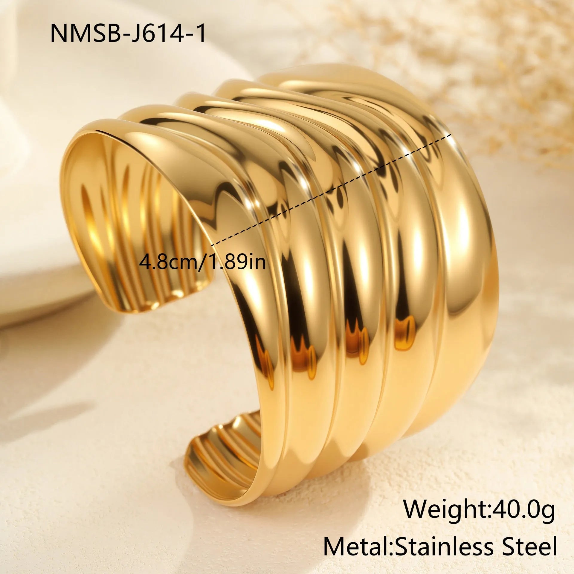 Gold plated stainless steel bracelet with exaggerated wide geometric wave design and asymmetric opening