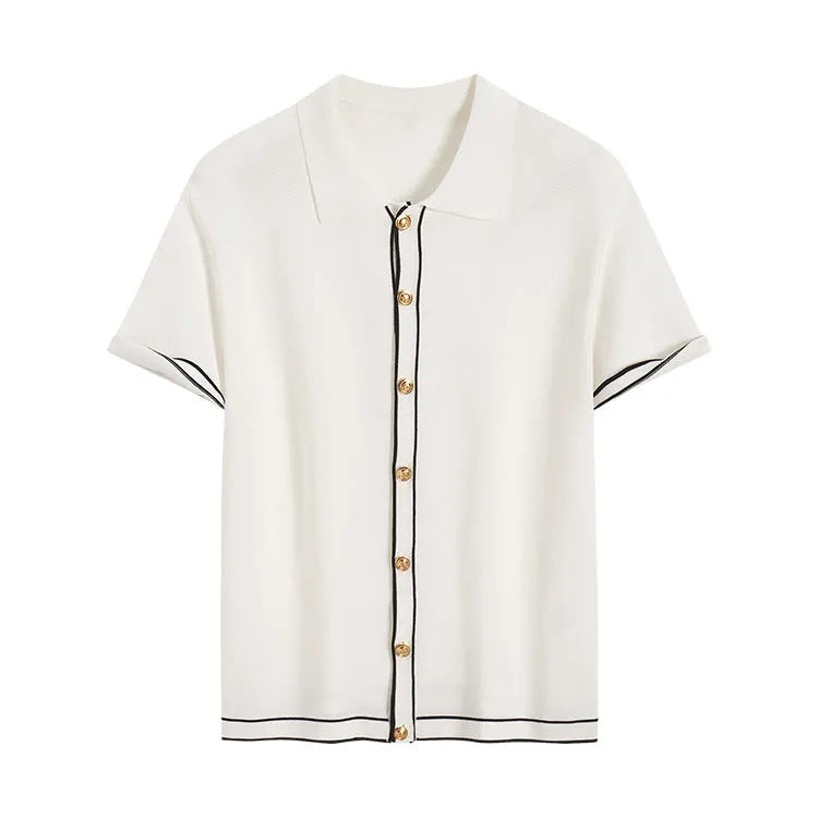 White women's short sleeve cardigan with dark contrast lapels on the collar.