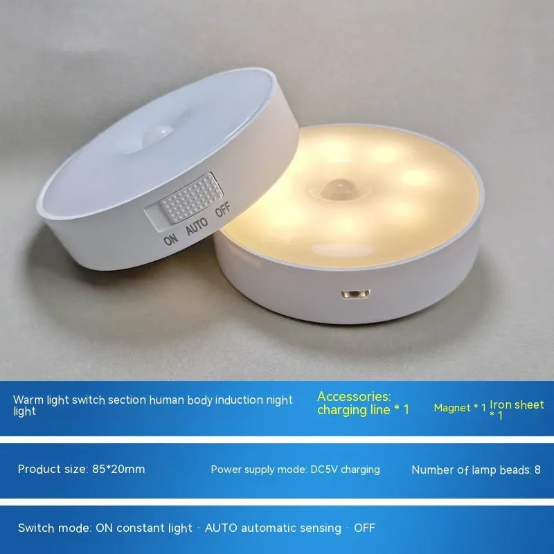 Small round beige or white LED night light with motion sensor and USB charging port