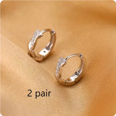 Geometric hemp rope earclip earrings with interwoven copper in gold and silver colours