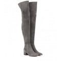 Grey women's suede over-the-knee flat boots with pointed toe and low thick heel on a rubber sole.