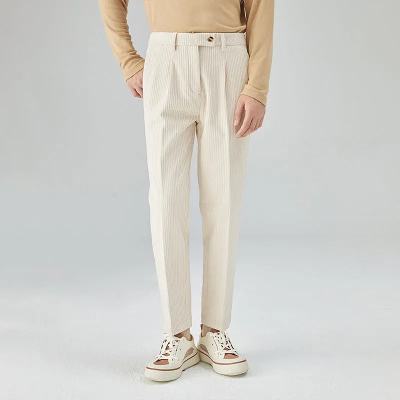 Men's straight-leg corduroy trousers in beige, black, and brown grey, showing mid-waist and micro elastic fabric detail.